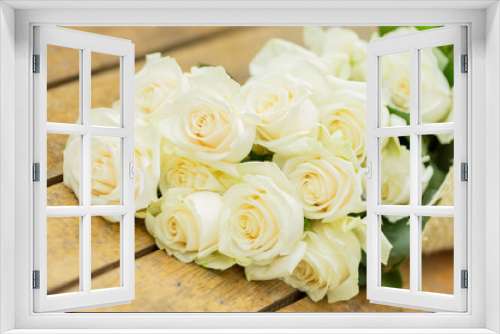 Fototapeta Naklejka Na Ścianę Okno 3D - Beautiful bouquet of white roses on the floor