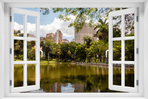 Fototapeta Naklejka Na Ścianę Okno 3D - Belo Horizonte Municipal Park, during a beautiful sunny day with the sky's clouds reflected in the lake.