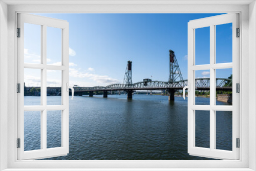 Fototapeta Naklejka Na Ścianę Okno 3D - A wide-angle photo of the Portland Hawthorne Bridge which passes over the Willamette River.