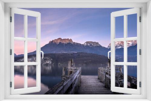 Fototapeta Naklejka Na Ścianę Okno 3D - Paysage du lac d'Annecy en Haute-Savoie au coucher du soleil en hiver entouré de montagne dans les Alpes françaises