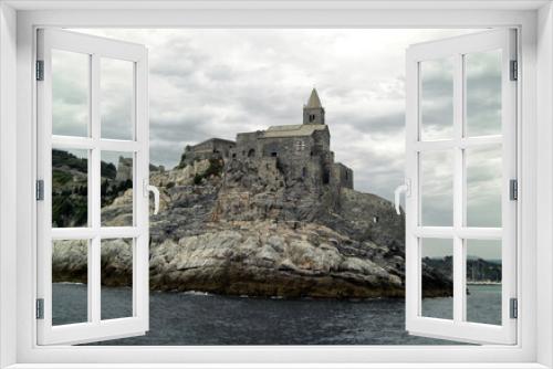 Fototapeta Naklejka Na Ścianę Okno 3D - Landscape of Portovenere with the Doria castle and the church of San Pietro as seen from the sea. Porto Venere, La Spezia, Italy