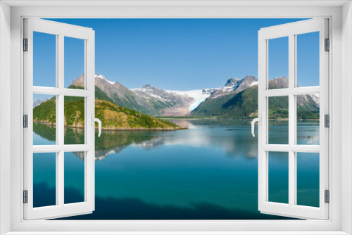 Fototapeta Naklejka Na Ścianę Okno 3D - An idyllic super panorama of the Svartisen Glacier vicinity, with the Saltfjell mountain range reflected in the tranquil fjord waters of Norway