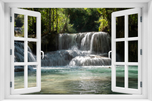Fototapeta Naklejka Na Ścianę Okno 3D - The Kuang Si Waterfall is located 30 km to the south of Luang Prabang in the Southeast Asian country of Laos.