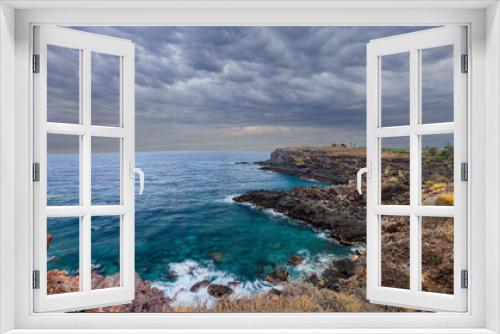 Fototapeta Naklejka Na Ścianę Okno 3D - Panoramic view of the coast of the island of Tenerife against a stormy sky..