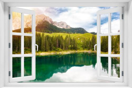 Fototapeta Naklejka Na Ścianę Okno 3D - Carezza lake surrounded by forest and mountains in Dolomite alps, Italy