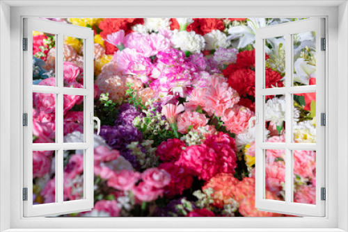 Fototapeta Naklejka Na Ścianę Okno 3D - Colorful artificial flowers background, in bloom 
