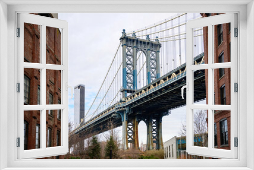Fototapeta Naklejka Na Ścianę Okno 3D - The iconic Manhattan Bridge, view from the well-known selfie spot at Washington Street intersection in Dumbo, Brooklyn, New York, USA