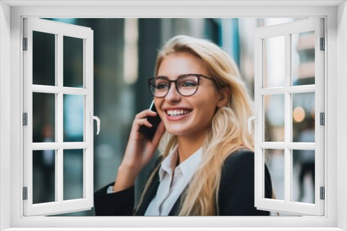 Blonde businesswoman happily talking on the phone