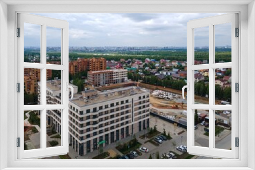 Fototapeta Naklejka Na Ścianę Okno 3D - the construction site of an apartment building in the summer from a height