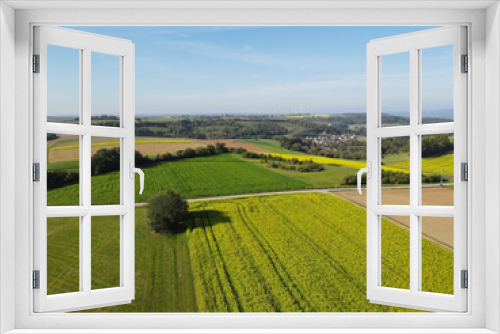 Fototapeta Naklejka Na Ścianę Okno 3D - Aerial view of farm fields in the countryside 