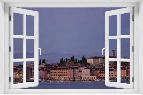 View of the embankment of Rovinj from the sea. The ships are in the harbor