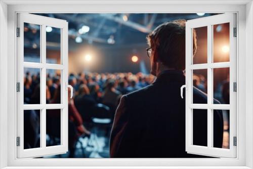 A man in a suit captivates a crowd with his impersonations at a team-building event. Generative AI.