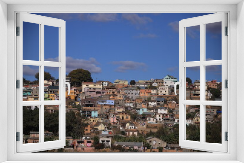 Fototapeta Naklejka Na Ścianę Okno 3D - colorful houses on a hill in Madagascar