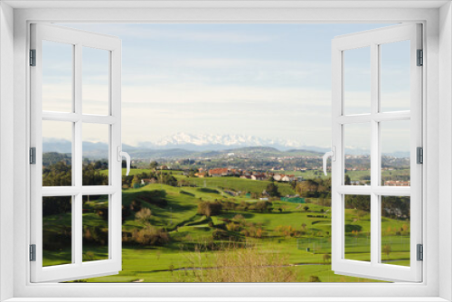 Fototapeta Naklejka Na Ścianę Okno 3D - Cantabria, view inland over Liencres area, snow on Picos de Europa mountain range