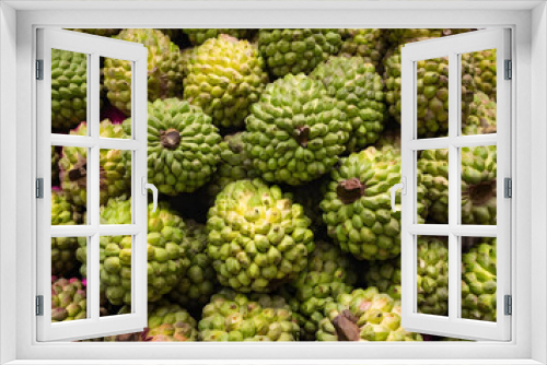 Fototapeta Naklejka Na Ścianę Okno 3D - Capture the vibrant street scene of custard apples being sold in Mumbai, India. Showcase the exotic allure of this tropical fruit against the backdrop of a bustling market, conveying the rich colors a