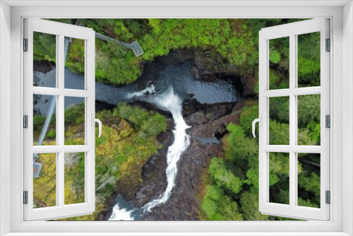 Fototapeta Naklejka Na Ścianę Okno 3D - Looking down on waterfall into canyon suspension bridge