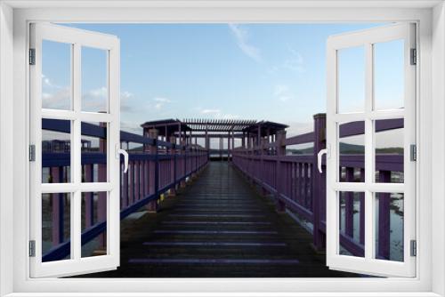 Fototapeta Naklejka Na Ścianę Okno 3D - purple wooden bridge at the seaside