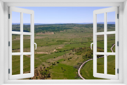 Fototapeta Naklejka Na Ścianę Okno 3D - Spring Aerial view of rural land near town of Godech, Bulgaria