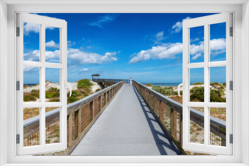 Fototapeta Naklejka Na Ścianę Okno 3D - Smyrna Dunes Park with elevated boardwalk and fishing pier in New Smyrna Beach, Florida.