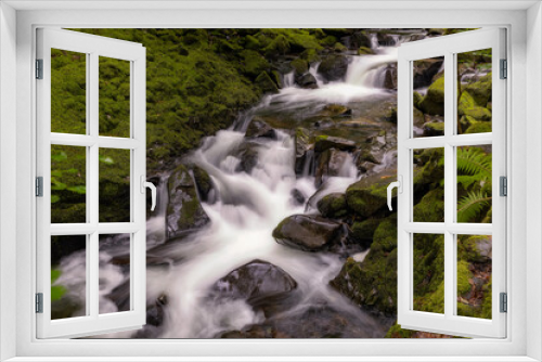 Fototapeta Naklejka Na Ścianę Okno 3D - Beautiful serene waterfall cascading through lush green foliage. Ceunant Mawr Waterfall, also known as Llanberis Falls in North Wales 