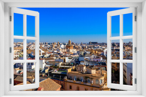 Fototapeta Naklejka Na Ścianę Okno 3D - Aerial panoramic view of the old city rooftops from the Giralda Tower in Seville, Andalusia, Spain
