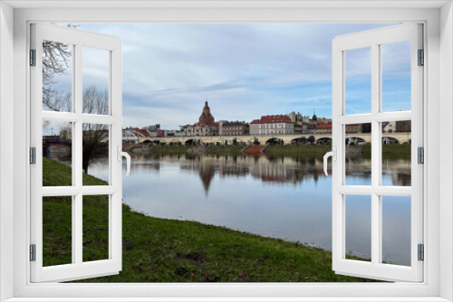 Fototapeta Naklejka Na Ścianę Okno 3D - Poland, Gorzow Wielkopolski - 18 February 2024: View of the Warta River. Warta River flood. Flooded banks and embankment. Bildings.