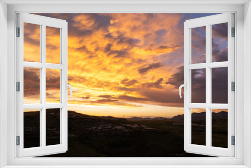 Fototapeta Naklejka Na Ścianę Okno 3D - A drone photograph of moody, deep color rich clouds at sunset. Shot over the Eastern Free State province in South Africa.