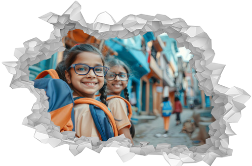 Small indian girls walking home from school. Two happy children on the streets of a city in India, with schoolbags. Education concept for kids