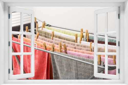 Fototapeta Naklejka Na Ścianę Okno 3D - Clean towels hanging on dryer, closeup