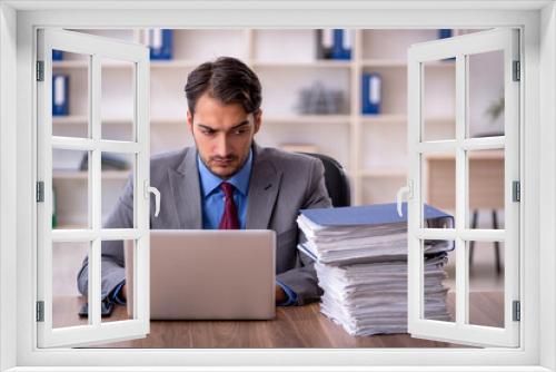 Young male employee working in the office