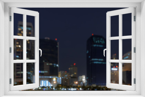 Fototapeta Naklejka Na Ścianę Okno 3D - City skyline at night - Blurred bokeh background