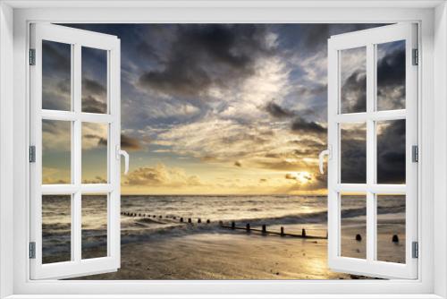 Fototapeta Naklejka Na Ścianę Okno 3D - Beautiful vibrant seascape at sunset image with dramatic sky and