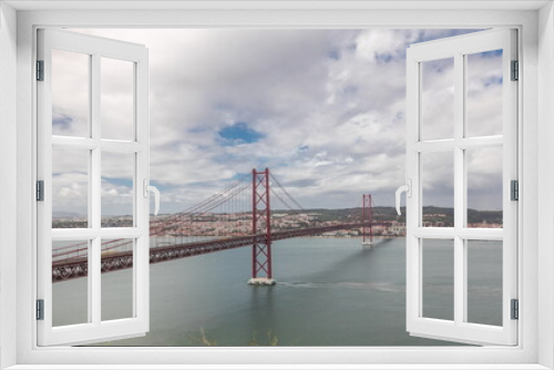 Fototapeta Naklejka Na Ścianę Okno 3D - Panorama showing Lisbon cityscape and Tagus river timelapse with 25 of April bridge