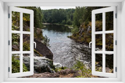 Fototapeta Naklejka Na Ścianę Okno 3D - Beautiful landscape with waterfall in northern forest on summer evening. Powerful stream of water among stone rocks and green foliage. Kivach waterfall at Suna river in Karelia, Russia.