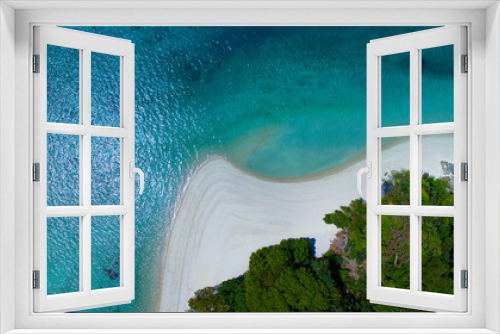 Fototapeta Naklejka Na Ścianę Okno 3D - The aerial view of white sand beach tropical with seashore as the island in a coral reef ,blue and turquoise sea Amazing nature landscape with blue lagoon	