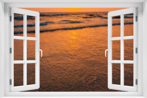 Fototapeta Naklejka Na Ścianę Okno 3D - Sunset on the beach and orange sea waves