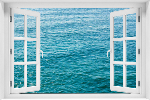 Fototapeta Naklejka Na Ścianę Okno 3D - Blue sea water background. Water surface texture. Top view. Copy space.