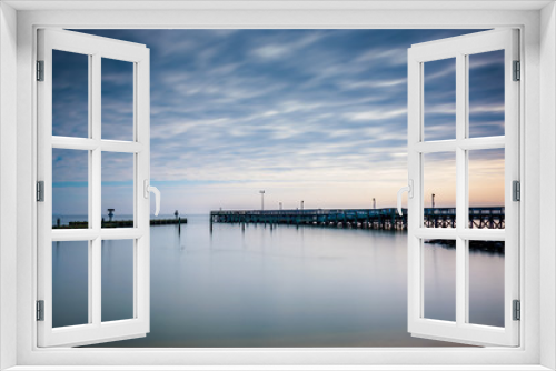 Fototapeta Naklejka Na Ścianę Okno 3D - Long exposure of a pier in the Chesapeake Bay, in North Beach, M