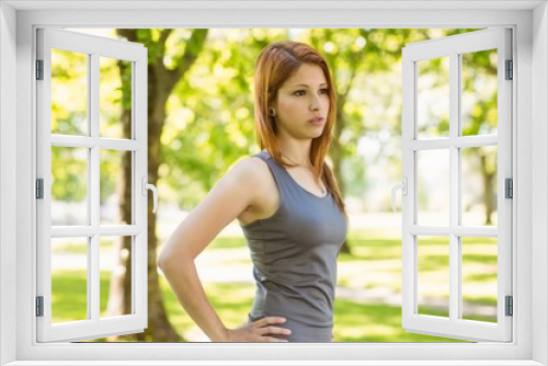 Pretty redhead resting in park