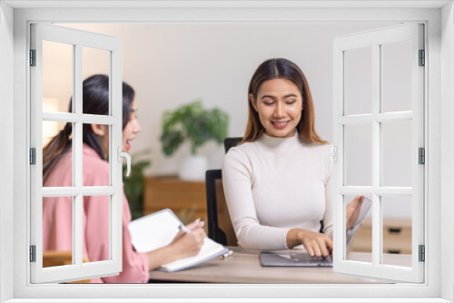 Two young asian happy business women working together for analyze planning and financial statistics and investment market  in home office space