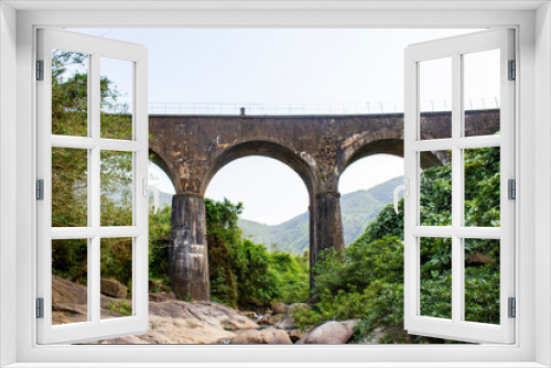 Fototapeta Naklejka Na Ścianę Okno 3D - Don Ca Arch Bridge At Hai Van Pass, Vietnam. This Bridge Is A Part Of An Elevated Vietnam Railway Track With Beautiful Landscape.