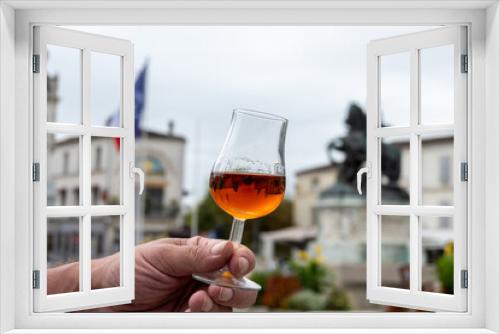 Fototapeta Naklejka Na Ścianę Okno 3D - Tasting of cognac alcohol drink and view on old streets and houses in town Cognac, Grand Champagne, Charente, strong spirits distillation industry, France