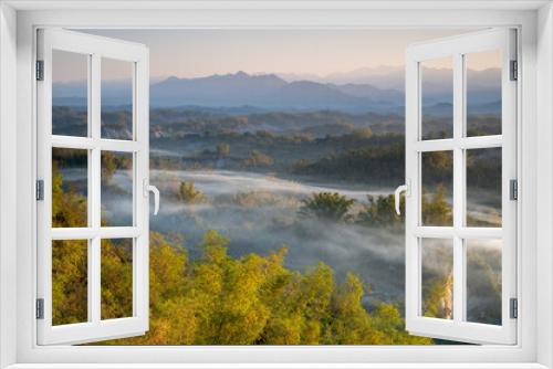 Fototapeta Naklejka Na Ścianę Okno 3D - In the morning, smoke curls up from the valley and the bamboo forest is green. The Erliao tribe in Zuozhen enjoys the sunrise landscape, Tainan City, Taiwan.