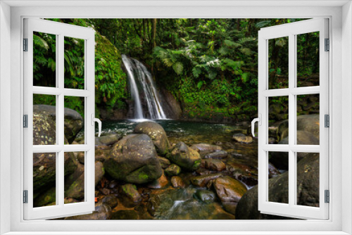 Fototapeta Naklejka Na Ścianę Okno 3D - Pure nature, a waterfall with a pool in the forest. The Ecrevisses waterfalls,
Cascade aux écrevisses on Guadeloupe, in the Caribbean. French Antilles, France