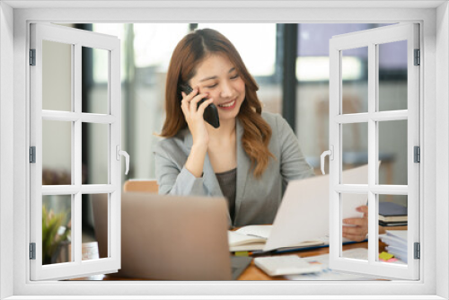 Asian businesswoman holding notebook about business, spending money