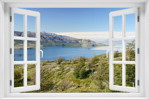 Fototapeta Naklejka Na Ścianę Okno 3D - Mountain view across a quiet lake