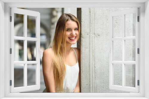 Beautiful blonde girl in urban background