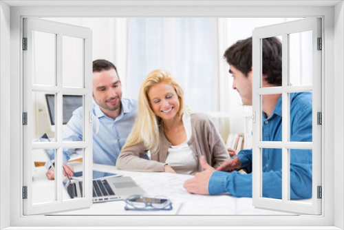 young serious couple meeting a real estate agent