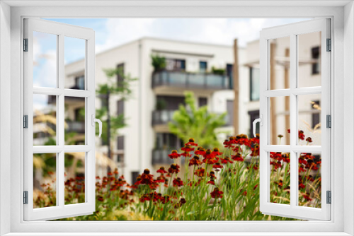 Fototapeta Naklejka Na Ścianę Okno 3D - Modern Landscape Design front Building Block Apartments. Green  Perennial Garden with Flower Plants as Landscaping Buildings.