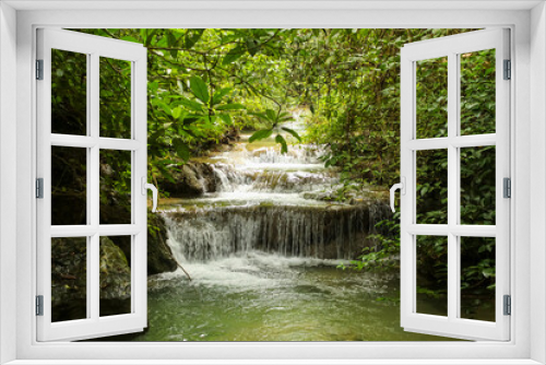 Fototapeta Naklejka Na Ścianę Okno 3D - Jungle landscape with flowing turquoise water of Erawan cascade waterfall